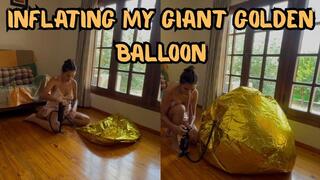 Inflating my giant golden balloon