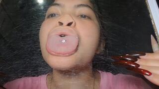 Little man against the glass; face, nose and tongue distorted