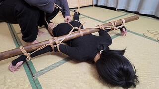 xr40-A girl in black stocking is tied to a cross