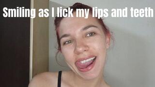 Smiling as I lick my lips and teeth