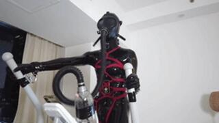 mz27 - A girl bound in latex walks on a treadmill