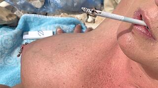 Smoking Cigarettes on the Beach at day and in Sunset (wmv)