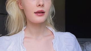 Smoking in cute top, looking at you