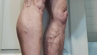 Tempest doing calf raises in bathroom