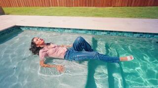 Carla Falls in the Pool Wearing Jeans and a Sheer Top