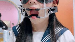 A beautiful and lovely Asian girl had her mouth stretched open and kept drooling.