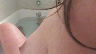 bath time book as she dips into the hot, clear water and says an introduction on the literature, then reads a few pages.