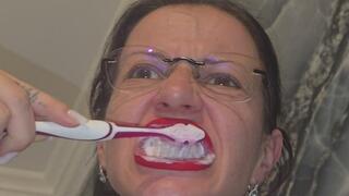 I brush my teeth, showing the inside of my mouth.