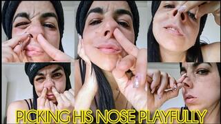 Picking his nose playfully