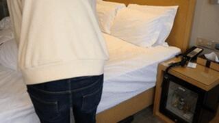 GG26 - A barefoot girl is bound by ropes and wrapped in a blanket.