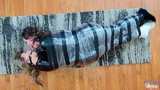Cara and Minx - Friends Wrapped, Wriggling and Double Ball Gagged (MP4 Format)
