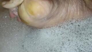 Tempest in bubble bath and showing feet