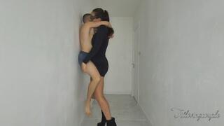 Giantess dominatrix pins small man against hallway wall