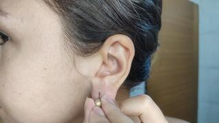 Close-Up Ear Play: Trying On Earrings