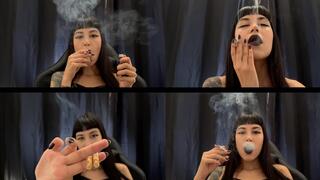 Goth girl devouring two Marlboros