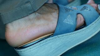 Sandals and foot fetish watching close-up, hot foot heels, the feet move continuously in an attractive way