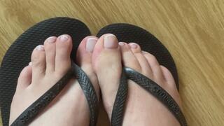 Toe tease in flip flops up close