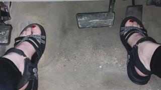 Evalynn playing with the pedals in sandals