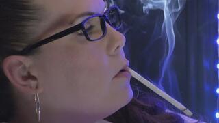 Sitting close in profile wearing my white halter, holding a VS 120 in my mouth