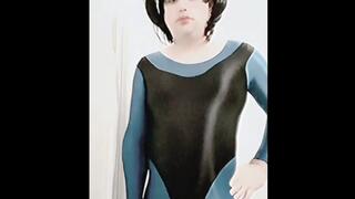 Shemale Ruby in shiny turquoise unitard and shiny black leotard