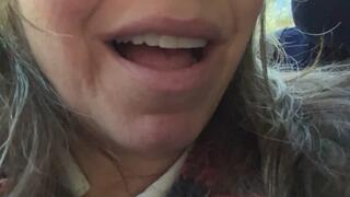 Sucking and chewing sweet tarts with a smile and a moan