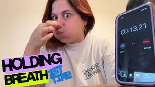 Puffing out cheeks, pinching nose, holding breath for the first time