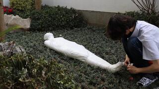 GG76-A cute girl, her entire body wrapped in duct tape, was left in the yard all day and brought to orgasm using a vibrator.