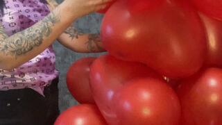 nail poping heart balloons