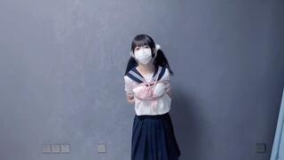GG81-A cute Asian girl dances after being bound by ropes.