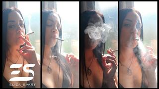 Smoking a Marlboro red in the sunlight while wearing a leather bikini top