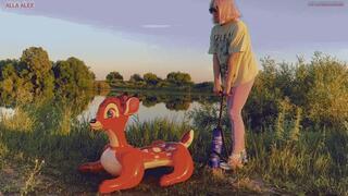 Alla tightly inflates the inflatable Bambi with a hand pump