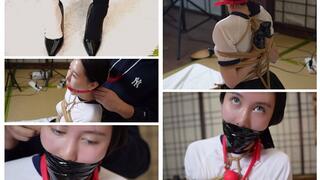 In this film starring the dancer her arms are bound in a difficult manner she wears two-tone stockings her mouth is gagged and taped shut which further accentuates her cheekbones and she is finally stuffed into a suitcase