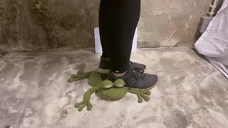 Crushing stuffed toy with sneakers