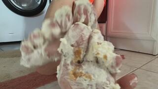 Messy barefoot cake trample in denim shorts