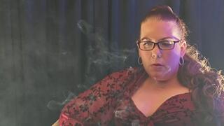 Sitting in a red blouse smoking a Virginia Slims menthol 120 playing with a rose