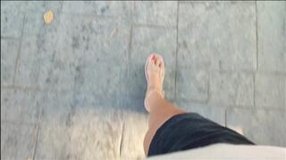 Mature woman driving driving and pumping pedals through the city (1)