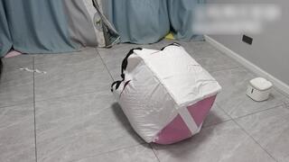 GG118-A barefoot Asian girl is bound within a die made of six carpets.