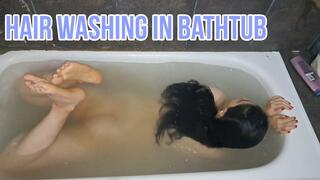 Hair washing in bathtub