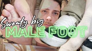 Sweaty big male foot after a long day