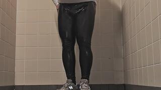 In bathroom with shiny leather leggings