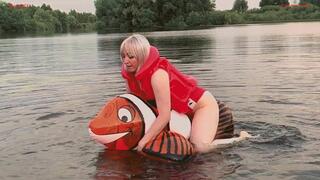 Alla hotly fucks a small transparent inflatable fish on the lake and wears an inflatable vest