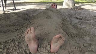 In buried beach sand with only my soles on the outside (3)