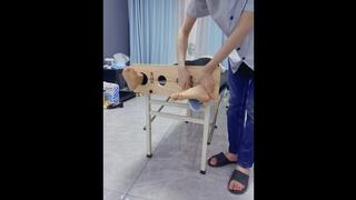 GG132-An Asian yoga teacher in white socks, handcuffed and shackled, tickles her feet on the bed, finally taking off her socks to tickle her bare feet.