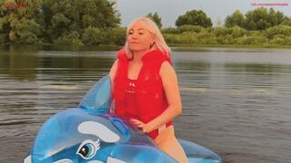 A very squeaky ride on a tightly inflated inflatable whale on a lake and a hot orgasm