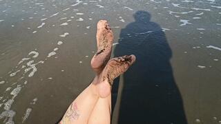 Some wrinkled and dirty soles on the beach (4)