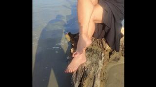 Beautiful woman with big legs crossed on the beach (1)