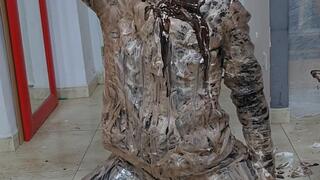 Human cake chocolate and cream leather mess