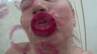 Red kissing sexy puffy lips on glass