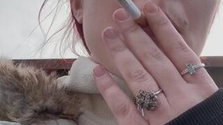 Smoking outside close up