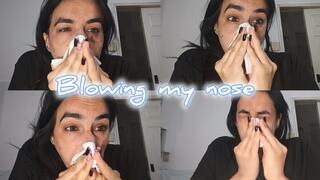 Blowing my nose because of a cold